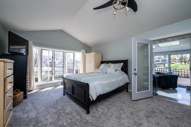 carpeted bedroom featuring a ceiling fan, multiple windows, access to exterior, and lofted ceiling