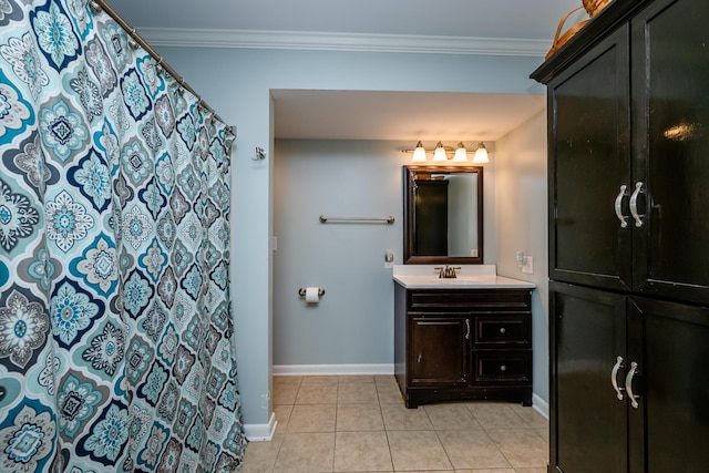 bathroom with ornamental molding, vanity, tile patterned floors, and baseboards