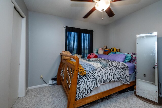 bedroom featuring baseboards, ceiling fan, and carpet floors