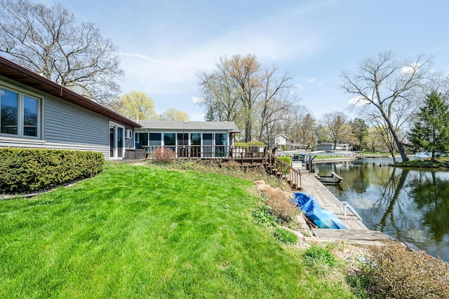 exterior space with cooling unit, a water view, and a sunroom