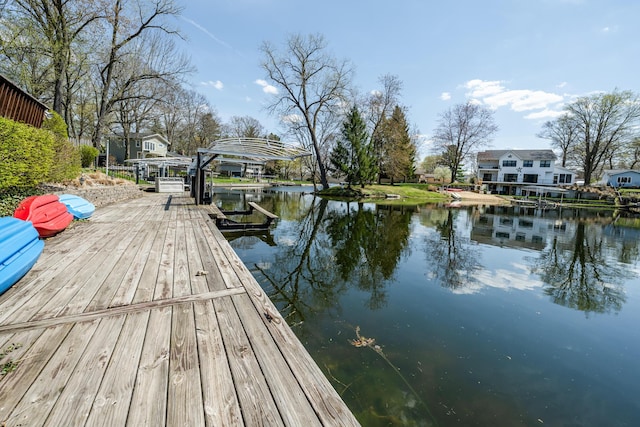 view of dock with boat lift and a water view