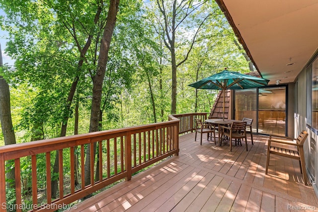 6897 Deerhill Dr, Clarkston, MI 48346 - wooden deck featuring outdoor dining area