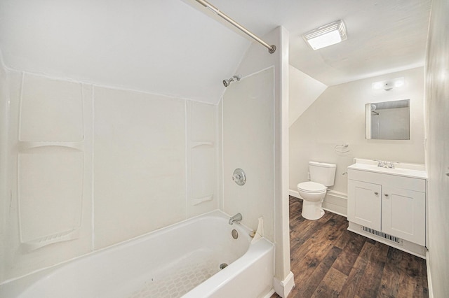 full bathroom with lofted ceiling, toilet, bathing tub / shower combination, wood finished floors, and vanity