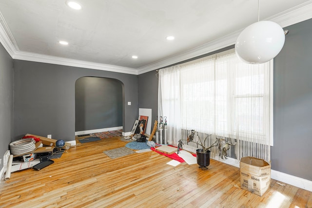 game room with recessed lighting, arched walkways, hardwood / wood-style flooring, baseboards, and crown molding