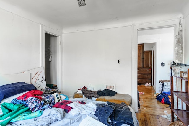 bedroom with hardwood / wood-style flooring