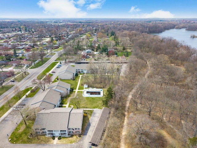 drone / aerial view with a water view and a residential view