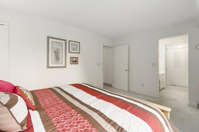 bedroom featuring visible vents and light carpet