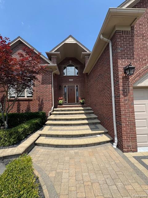 8535 Lillian Dr, Washington, MI 48094 - property entrance with brick siding
