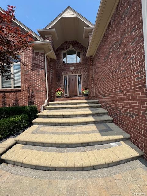 8535 Lillian Dr, Washington, MI 48094 - property entrance featuring brick siding