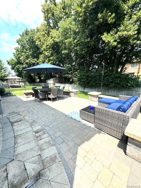 8535 Lillian Dr, Washington, MI 48094 - fenced backyard with a patio area, an outdoor living space, and outdoor dining space