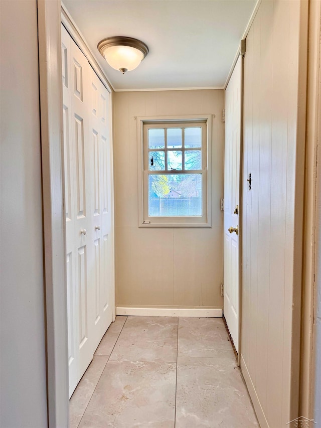 2408 N Mason St, Saginaw, MI 48602 - doorway with baseboards and crown molding