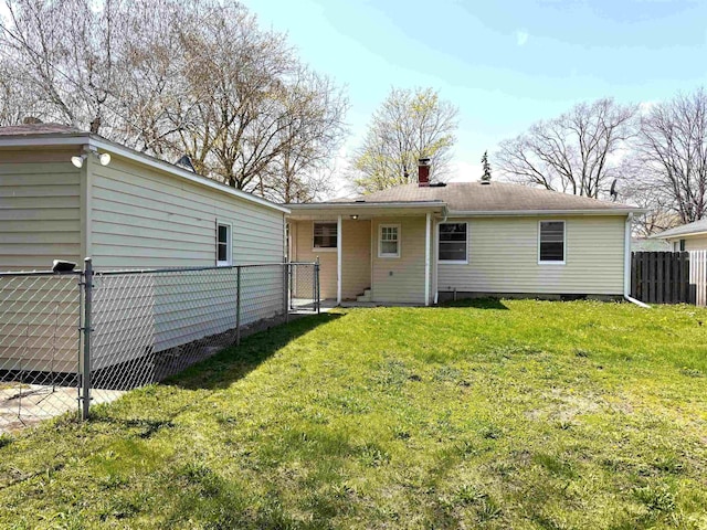 2408 N Mason St, Saginaw, MI 48602 - back of property with a chimney