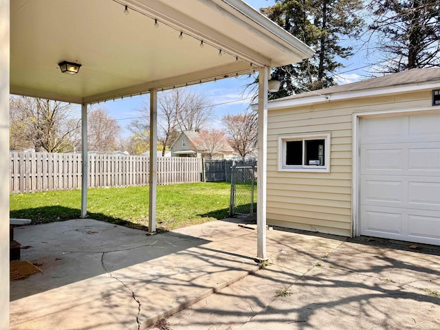 2408 N Mason St, Saginaw, MI 48602 - view of patio featuring an outdoor structure and a garage