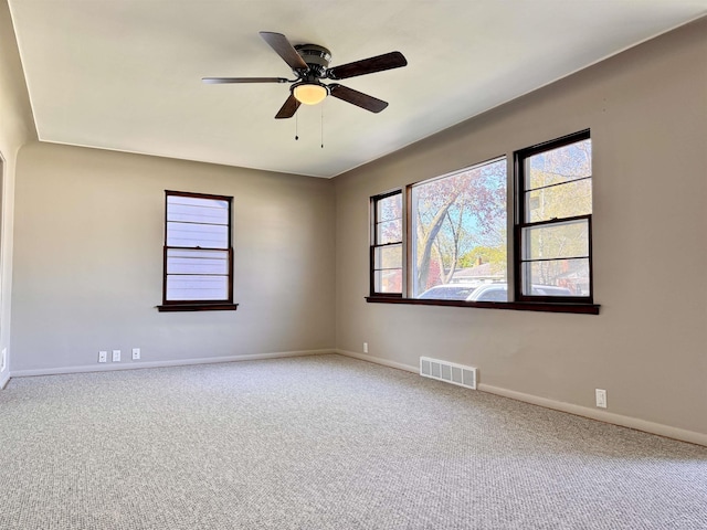 2408 N Mason St, Saginaw, MI 48602 - unfurnished room with carpet flooring, baseboards, and ceiling fan