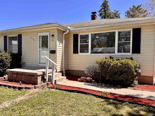 2408 N Mason St, Saginaw, MI 48602 - ranch-style home featuring a chimney