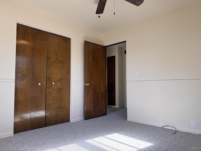 2408 N Mason St, Saginaw, MI 48602 - unfurnished bedroom with carpet, a closet, a ceiling fan, and baseboards