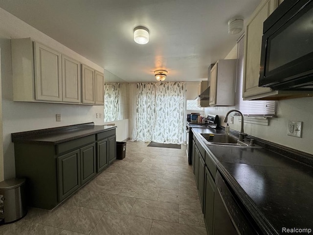 kitchen featuring range with electric cooktop, a sink, black microwave, dark countertops, and a healthy amount of sunlight