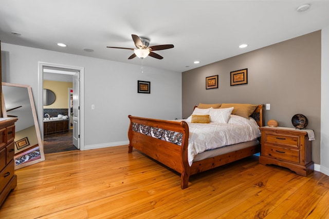 bedroom with light wood-type flooring, recessed lighting, and baseboards
