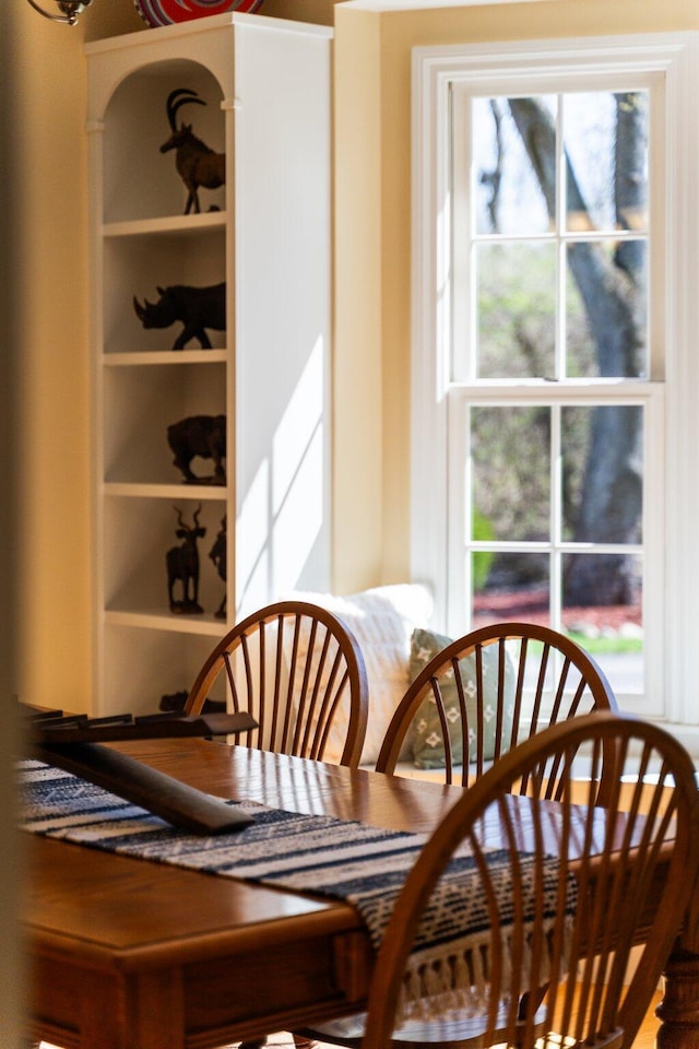 dining room featuring built in shelves