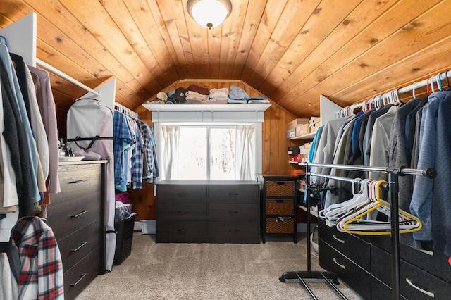 spacious closet with lofted ceiling and carpet flooring