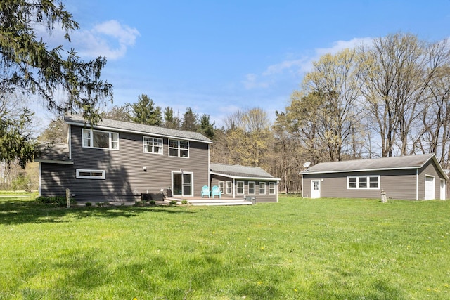 back of property with a yard and a patio area