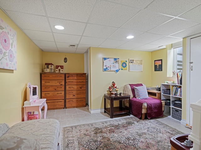 tiled bedroom featuring baseboards, recessed lighting, a paneled ceiling, and visible vents