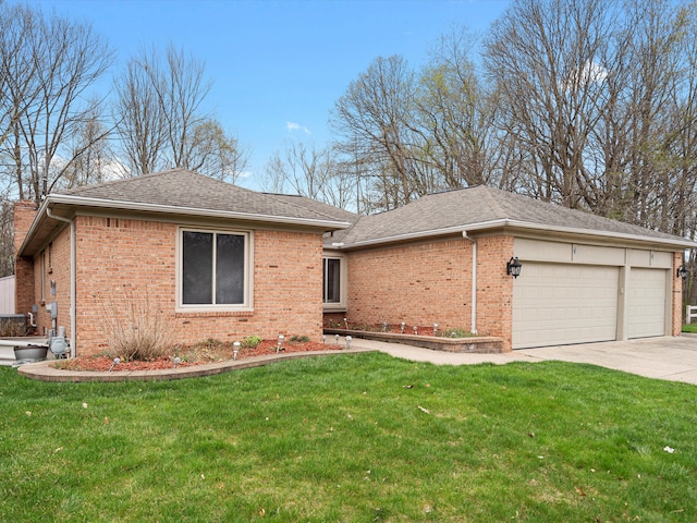 ranch-style home with a shingled roof, an attached garage, brick siding, a front yard, and concrete driveway