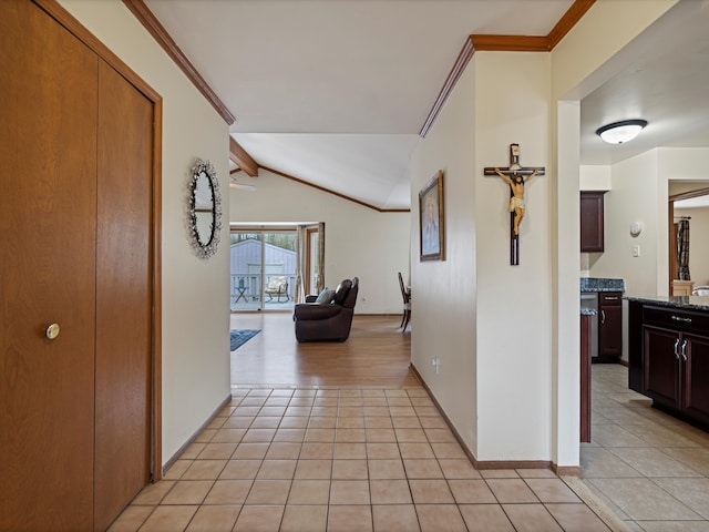 hallway featuring vaulted ceiling with beams, baseboards, crown molding, and light tile patterned floors