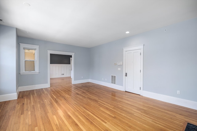 unfurnished living room with visible vents, recessed lighting, light wood-style flooring, and baseboards
