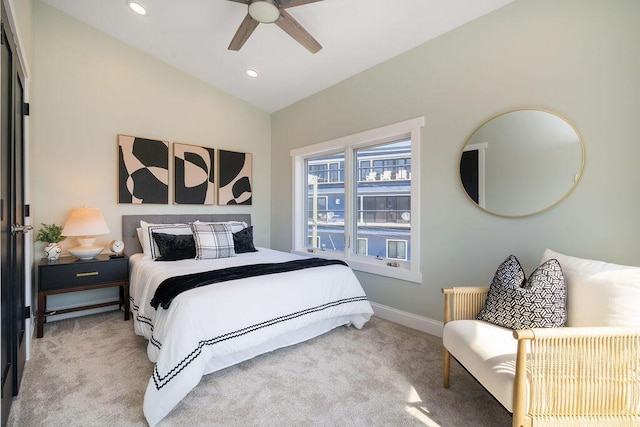 bedroom featuring carpet floors, a ceiling fan, baseboards, and lofted ceiling