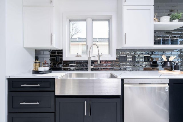 kitchen featuring stainless steel dishwasher, decorative backsplash, white cabinetry, and open shelves