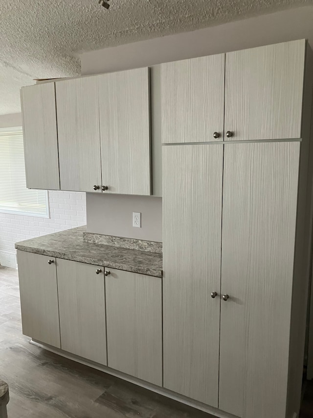 1271 Featherstone Rd, Pontiac, MI 48342 - kitchen featuring dark wood-style flooring and a textured ceiling