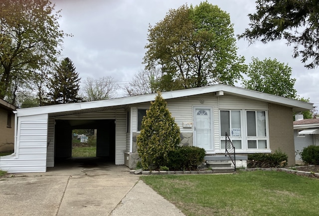1271 Featherstone Rd, Pontiac, MI 48342 - ranch-style home with concrete driveway, a front yard, and a carport