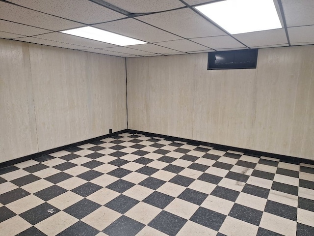 1271 Featherstone Rd, Pontiac, MI 48342 - finished below grade area with baseboards, a drop ceiling, and light floors