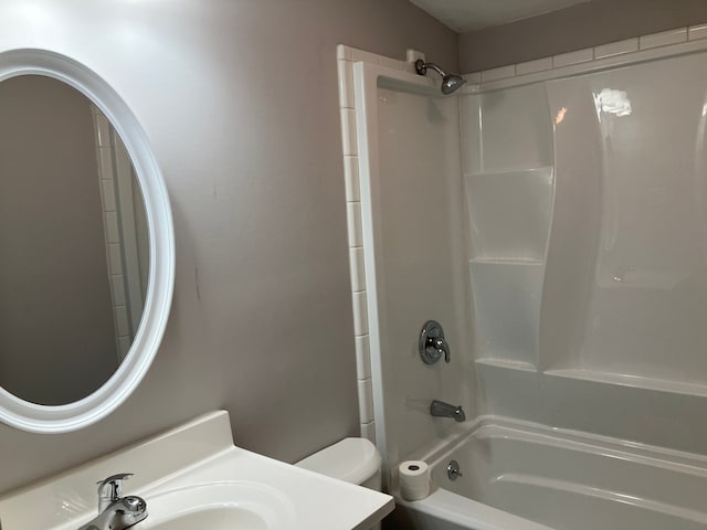1271 Featherstone Rd, Pontiac, MI 48342 - bathroom featuring toilet, vanity, and bathtub / shower combination