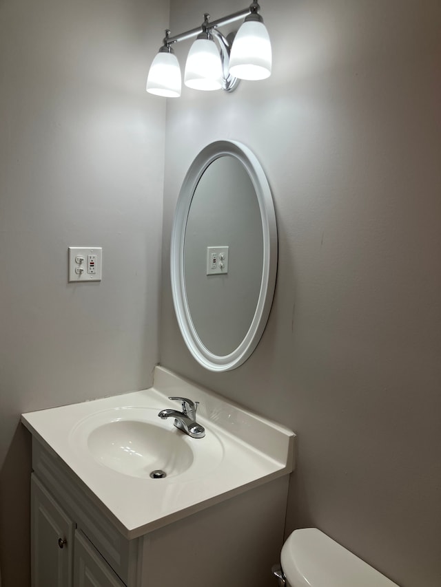 1271 Featherstone Rd, Pontiac, MI 48342 - bathroom featuring vanity and toilet