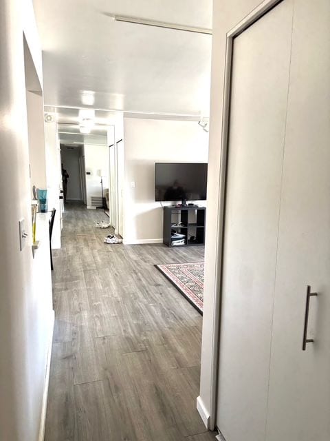 hall featuring wood finished floors