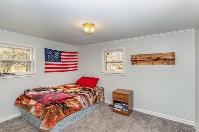 carpeted bedroom featuring crown molding, multiple windows, and baseboards