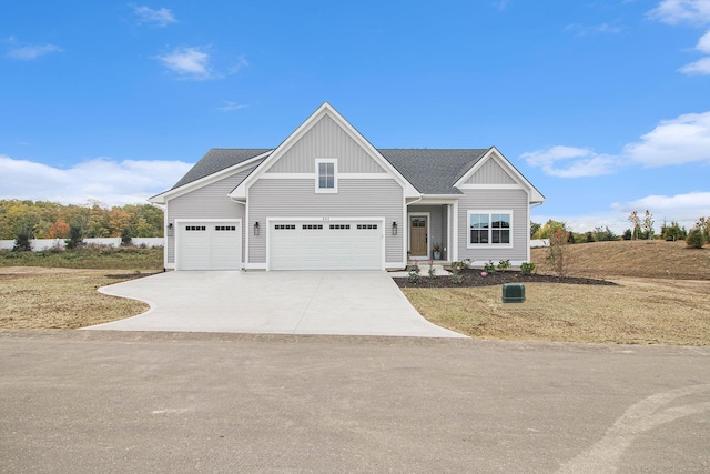 craftsman-style home featuring driveway and board and batten siding