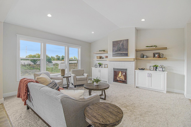 living room with recessed lighting, wood finished floors, a fireplace, baseboards, and lofted ceiling