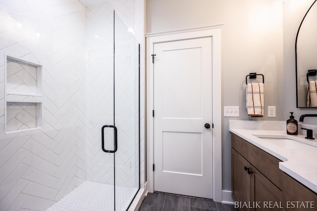 bathroom featuring vanity and a stall shower