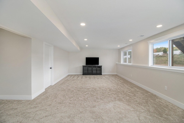 below grade area featuring baseboards, recessed lighting, and carpet floors