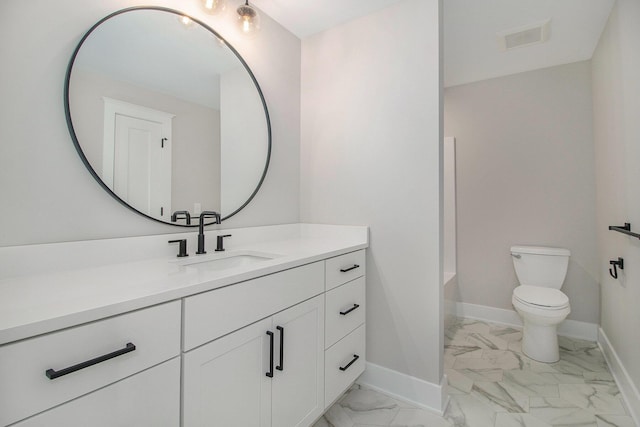bathroom featuring vanity, toilet, marble finish floor, visible vents, and baseboards