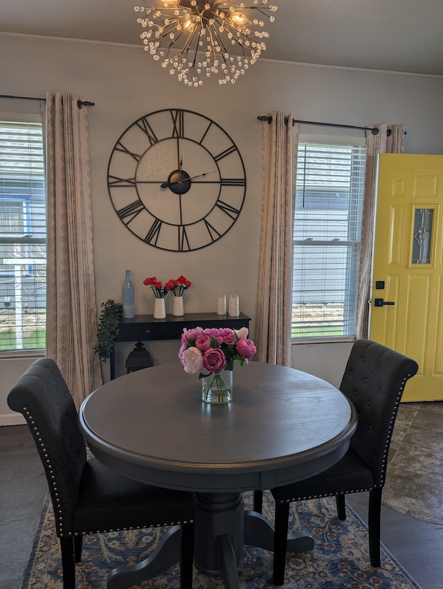dining space with a healthy amount of sunlight and a notable chandelier