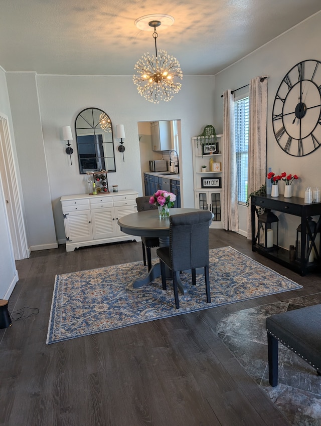 dining room with baseboards, an inviting chandelier, and dark wood-style flooring