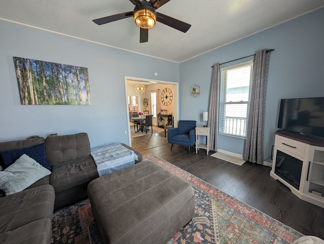 living area with wood finished floors and ceiling fan