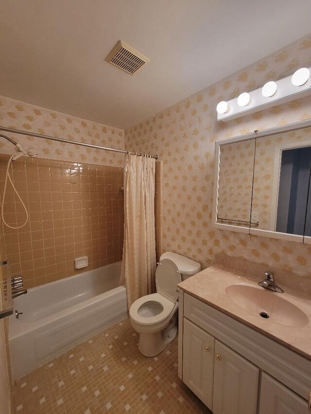 full bath with wallpapered walls, toilet, vanity, visible vents, and shower / tub combo