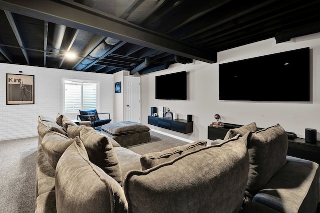home theater with brick wall and carpet