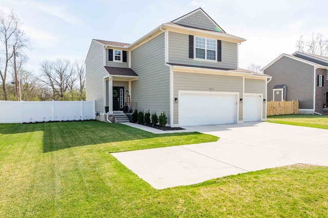 traditional home with fence, an attached garage, a front lawn, and driveway