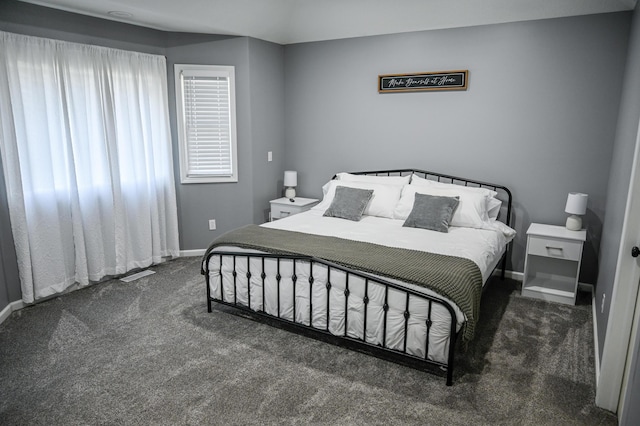 bedroom featuring carpet flooring and baseboards